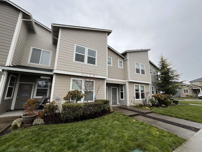 Photo - Stylish Two-Story Living with Fireplace, Island Kitchen & Private Primary Suite