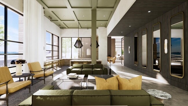 Amplio salón club con espacio para reuniones y asientos cómodos. - Modera Revere Beach