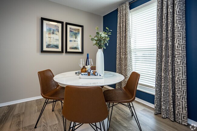 Dining area with hardwood-style flooring
