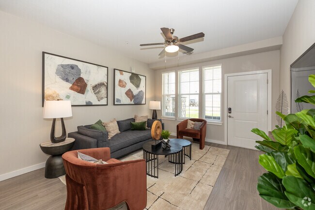 2BR, 2BA - 1,089SF - Living Room - Springs at Pena Station