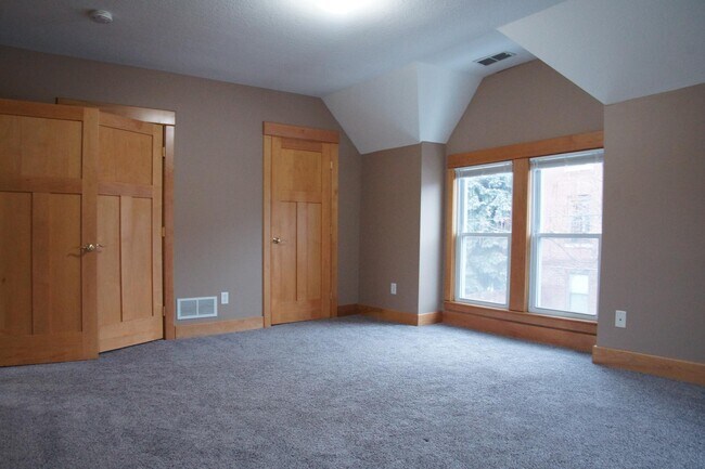 Southeast bedroom with 2 closets. All bedrooms now have new hardwood that matches hallway wood. - 513 W Franklin Ave