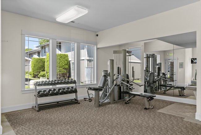 On-site fitness center with strength equipment and free weights.