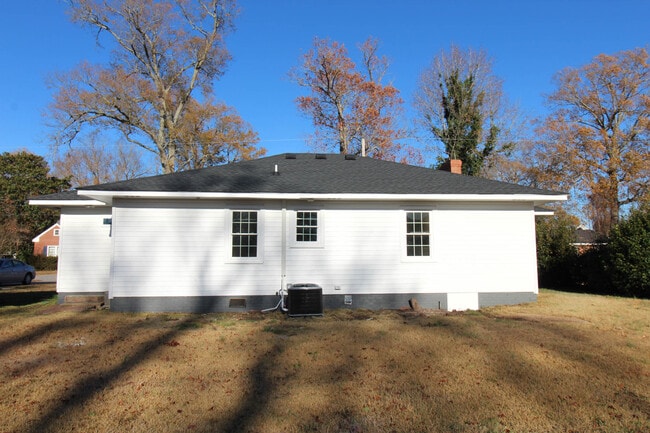 Back of house with new HVAC