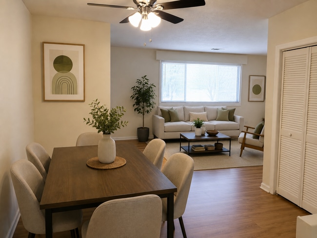 Dining Area / Living Room (AI-staged) - 411 Cattleman Dr NE
