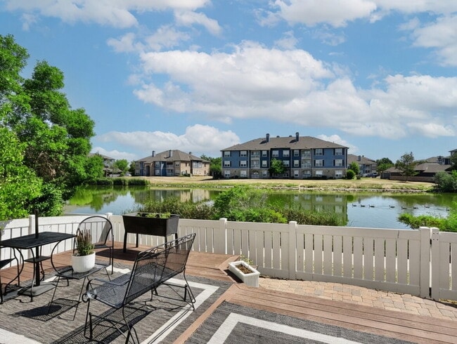 Building Photo - Lakeside 3 Bed/2.5 Bath Townhome in Gateway Community! Quiet, Scenic Living in The Heart Of Denver! Unit 74
