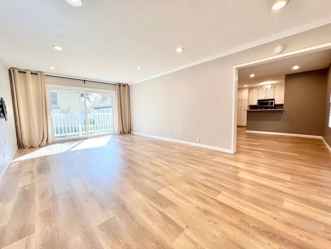 Building Photo - Contemporary 2 Bed Condo with 2 Garage Parking Spaces, Community Pool, and 3 Private Balconies