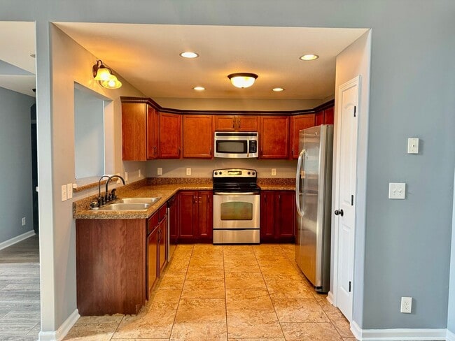 Photo - Large Open 4 Bedroom Home with Bonus! Tree Lined Backyard with Privacy Fence!