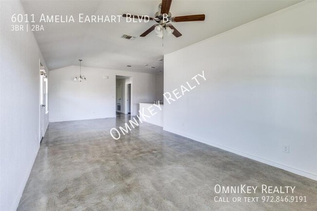 Building Photo - 6011 Amelia Earhart Blvd Unit B