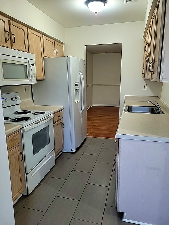 Photo - Spacious 3BR Townhome • $2,150 • Fenced Yard + Bonus Room • Prime Location