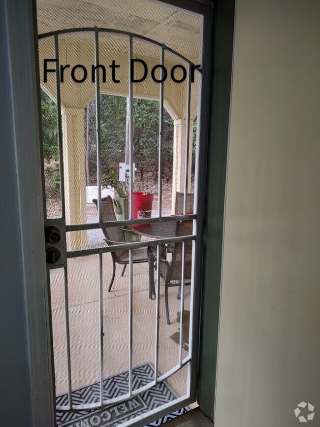 Main entrance showing Covered patio w table and chairs - 6588 Log Cabin Ln Unit Apartment