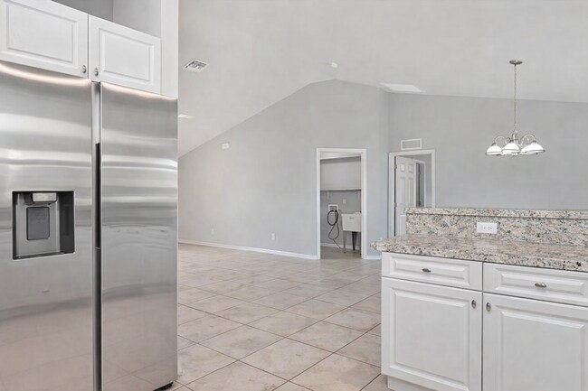 Photo - Spacious Three-Bedroom Home with Open Floor Plan, Large Yard & Screened Patio