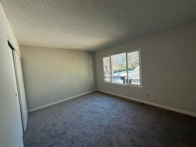 Photo - Quiet unit with new paint, new carpet, new windows and Air Conditioning!