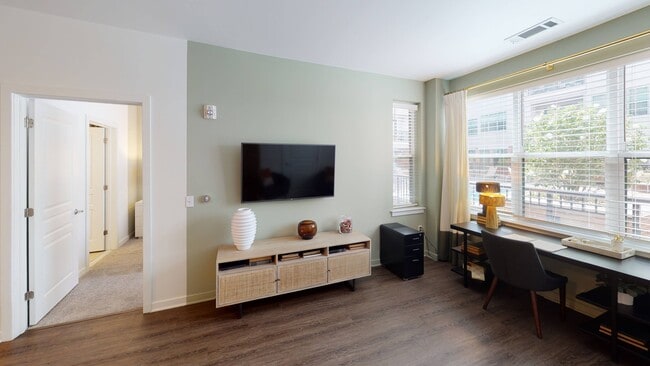 Natural light pours in through the living area's open windows
