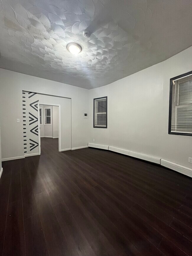 Living room new flooring and paintwork - 125 S 9th St House