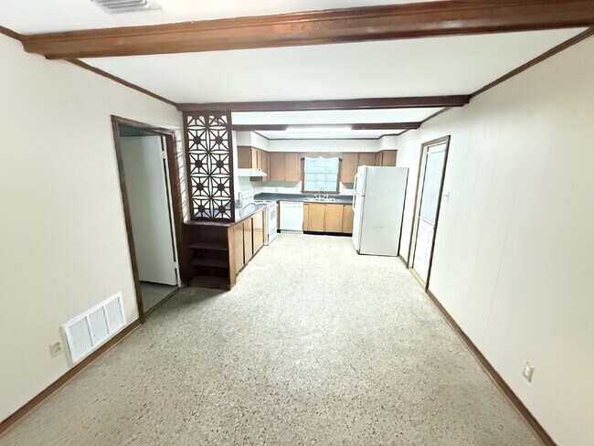 Welcome home to this charming 3-bedroom, 1.5-bathroom brick home featuring a spacious living and ...