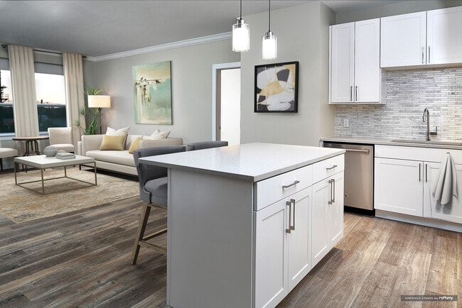 Signature Collection kitchen and living room with hard surface flooring