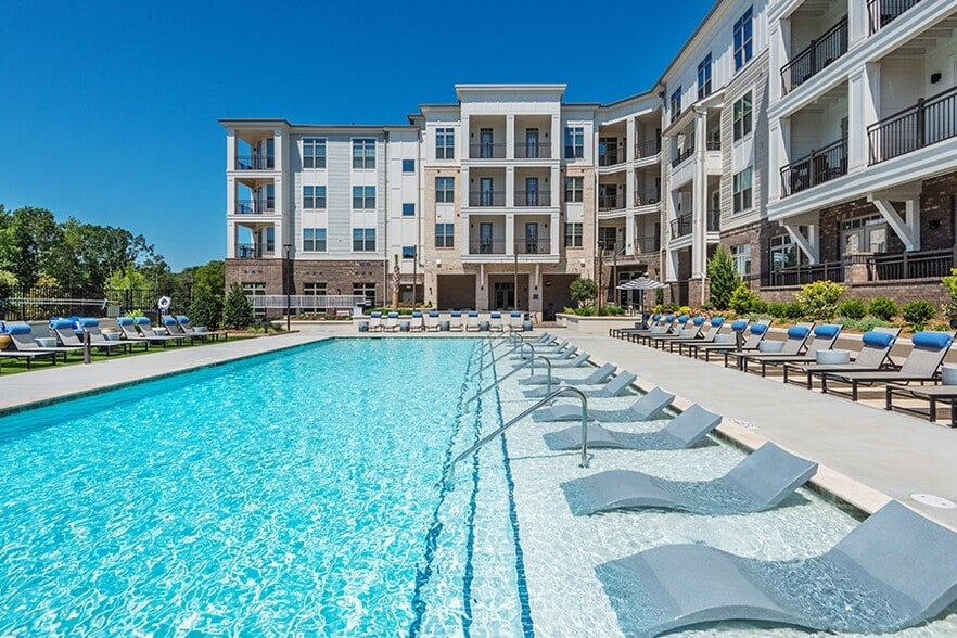 Relax on the sun shelf of our resort-style saltwater pool