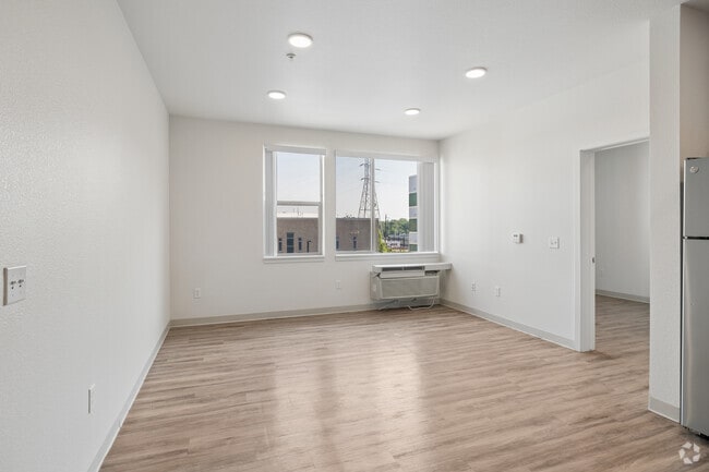 3BR, 2BA - 1,127SF - Living Room - Indy Street Flats