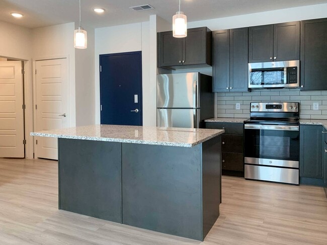 Our kitchens provide plenty of counter space and cabinetry, making meal prep and storage simple and efficient for your lifestyle. - 2twenty2 Apartments