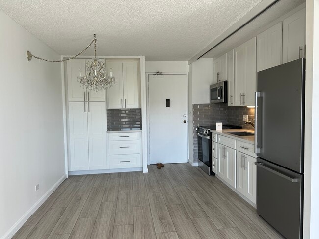 Kitchen with Ample Cabinets - 1655 Makaloa St Unit 1814