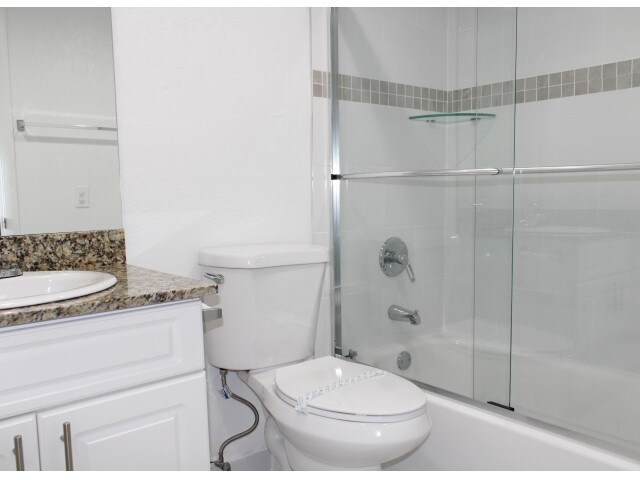 Bathroom with Glass Shower Enclosures - Las Brisas Gardens Apartments