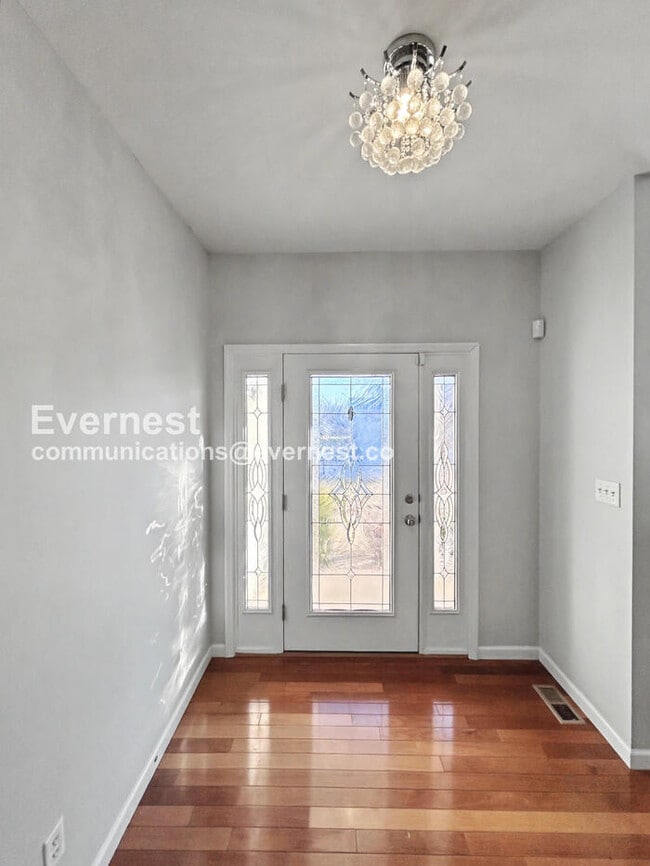 Photo - Spacious 4-Bed Home with 2-Car Garage & Modern Amenities