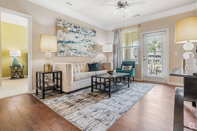 Bright Living Room with Ceiling Fan - St. James at Goose Creek Apartments