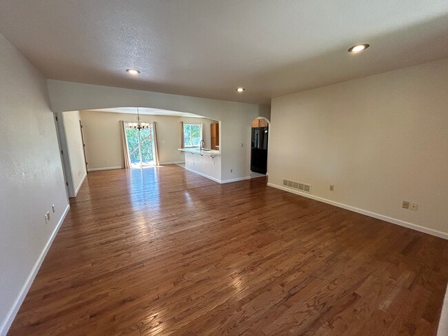 From the front door, you enter the living room, which opens to the dining area and kitchen - 4393 N Lincoln Ave