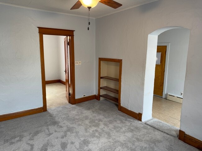 Large living room with brand new carpet , hardwood trim and doorways thru-out entire unit. - 2346 122nd St Unit One Rear