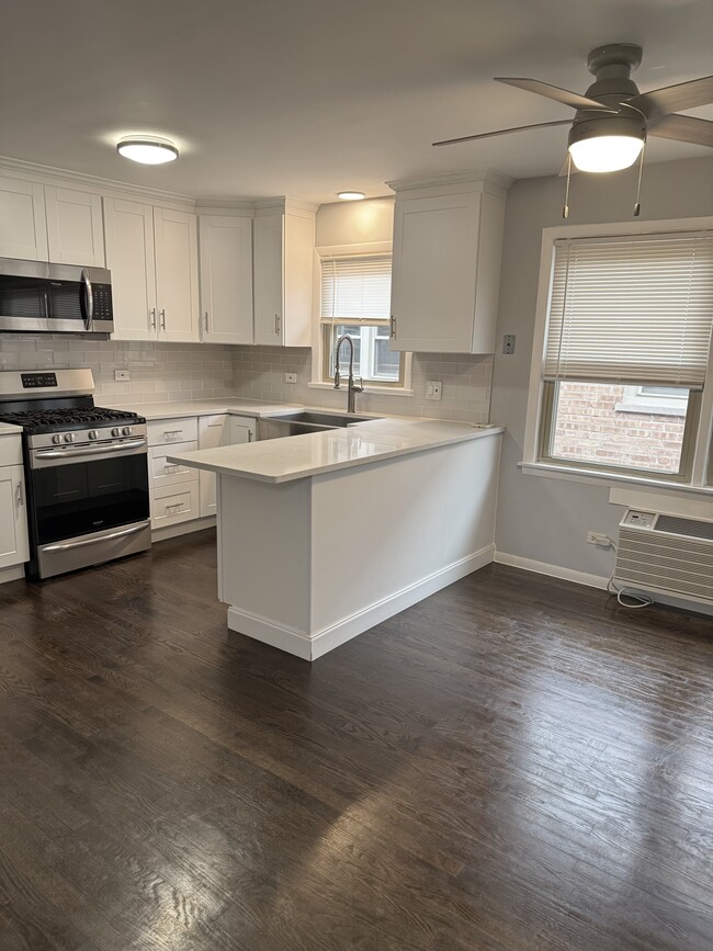 Building Photo - 8222 Grand Ave Unit 3a