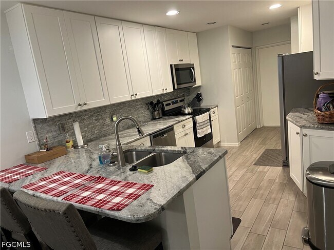 Building Photo - 12030 Champions Green Way Unit 212