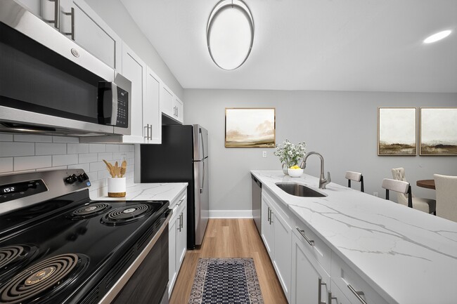 Step into the modern kitchen at The Woods at Ambler, an Eagle Rock Community, where contemporary design meets functionality. With sleek appliances and ample counter space, it's perfect for culinary enthusiasts. Schedule your tour today!