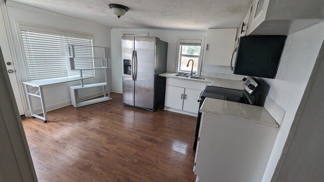 Kitchen refreshed cabinets - 203 Johnson St Unit #A
