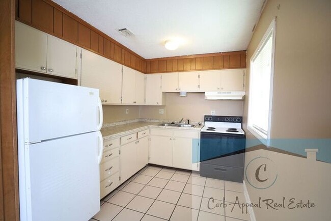 Photo - This 2 bedroom 1 bath apartment - includes refrigerator, stove and dishwasher.
