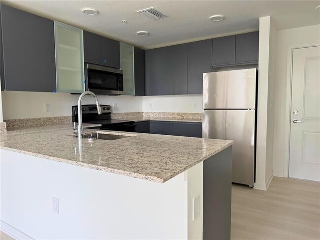 Building Photo - 5592 Pga Blvd Unit 304