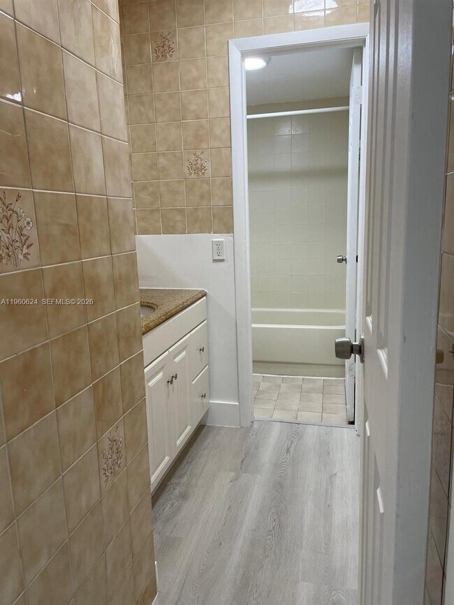 Photo - 1075 W 68th St Unit 304