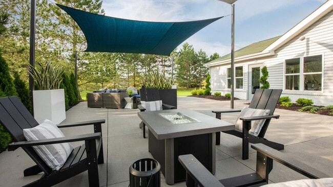 Enjoy the outdoors on our patio area featuring covered seating and comfortable furnishings, professionally operated by Highlands Vista Group.