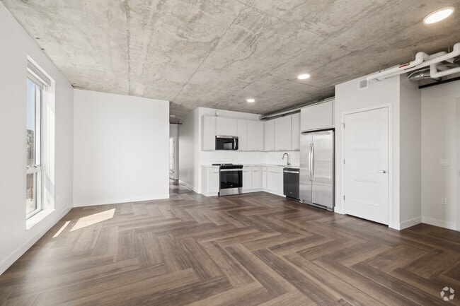 2BR, 2BA - 1,130SF - Kitchen and Living Room