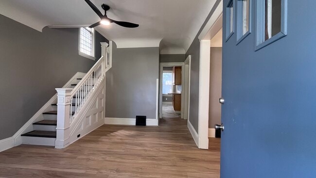 Foyer entrance with stairs to bedroom and dining room adjacent - 2366 E 85th St
