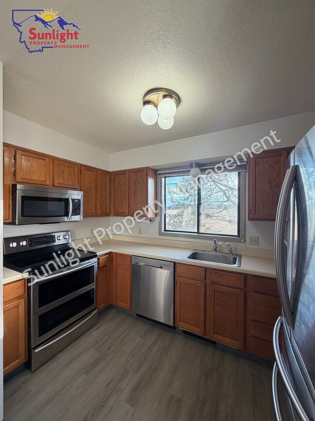 Building Photo - Updated 2-Bedroom Condo in the Heights – Garage, Balcony & Views Unit 2