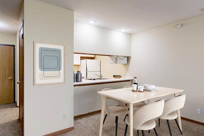 Comfortable and connected, your dining area is perfect for casual meals or catching up with friends. - Pine Lake Heights Apartments