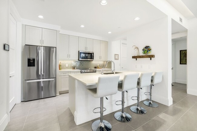 Photo - Luxury Living Meets Prime Location! Naples Square 2/2 Condo with Expansive Terrace
