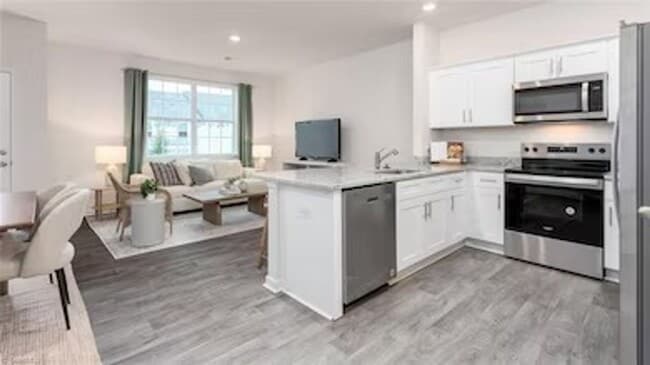 Photo - Modern 3-Bedroom Townhome with Garage in North Village Townes