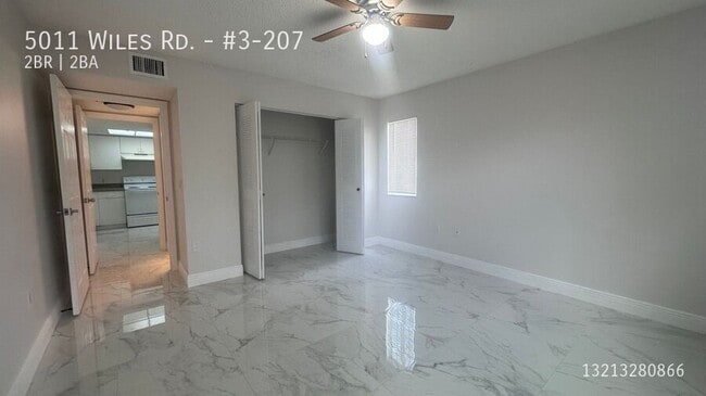 Building Photo - 5011 Wiles Rd Unit #3-207