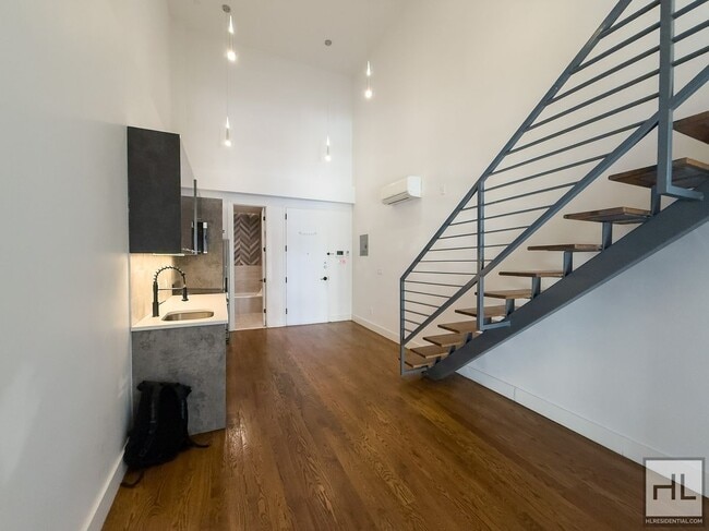 Building Photo - Stunning Two-Bedroom Duplex with Soaring 1... Rental