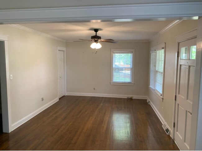 Living room, hardwood floors, small coat closet in corner