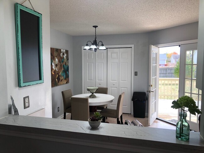 Dining area with view of deck and back yard