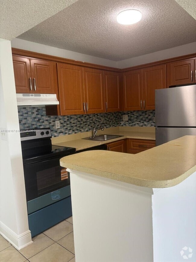 Building Photo - 7110 NW 179th St Unit 211 Rental