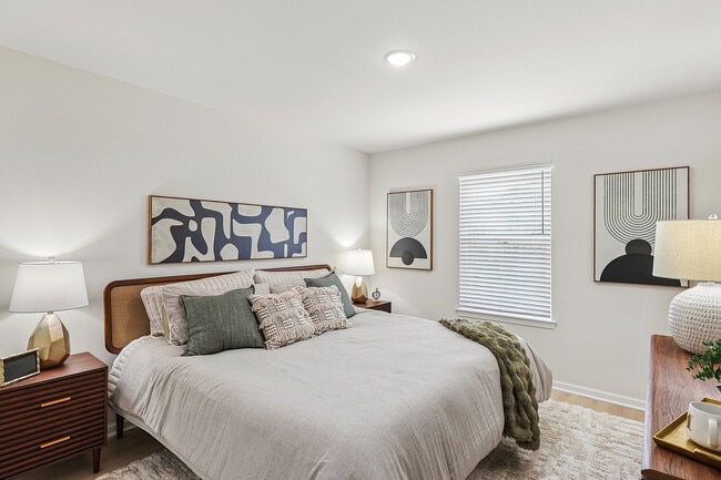 Spacious primary suite with plenty of room for a king-size bed and more