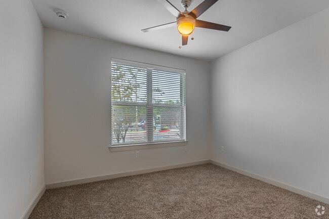 B1 2BR, 2BA - 1,079SF - Primary Bedroom
